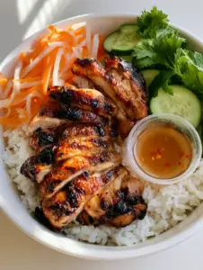 Close up handheld smartphone photo of seared Vietnamese Lemongrass Chicken showing deep golden-brown caramelization and fresh herbs.